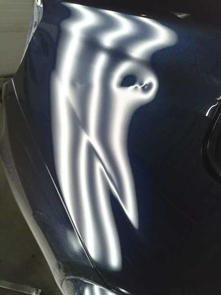 Беспокрасочное выпрямление вмятин до